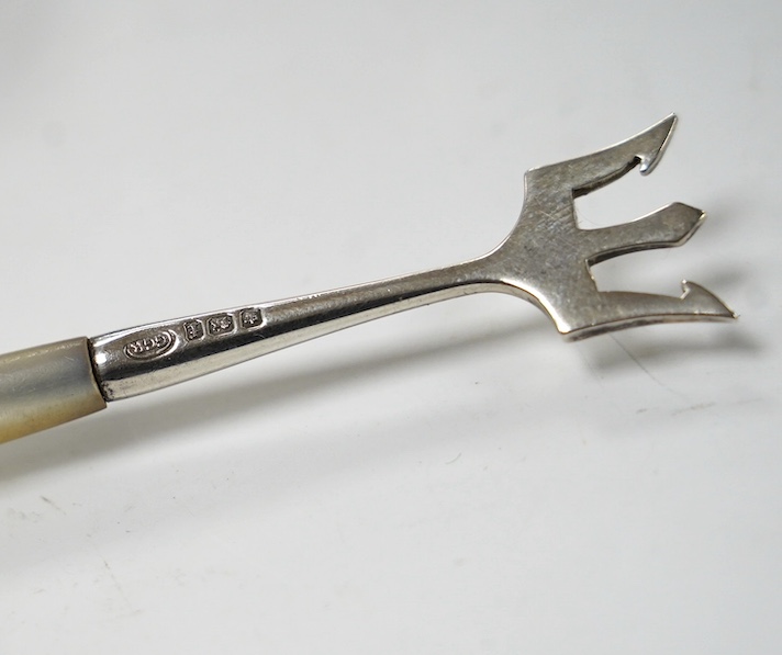 An Edwardian silver folding pen holder, by Jordan & Raybould, London, circa 1902, 7cm, together with an Edwardian silver purse, two silver napkin rings, a small quantity of assorted flatware including George III table sp